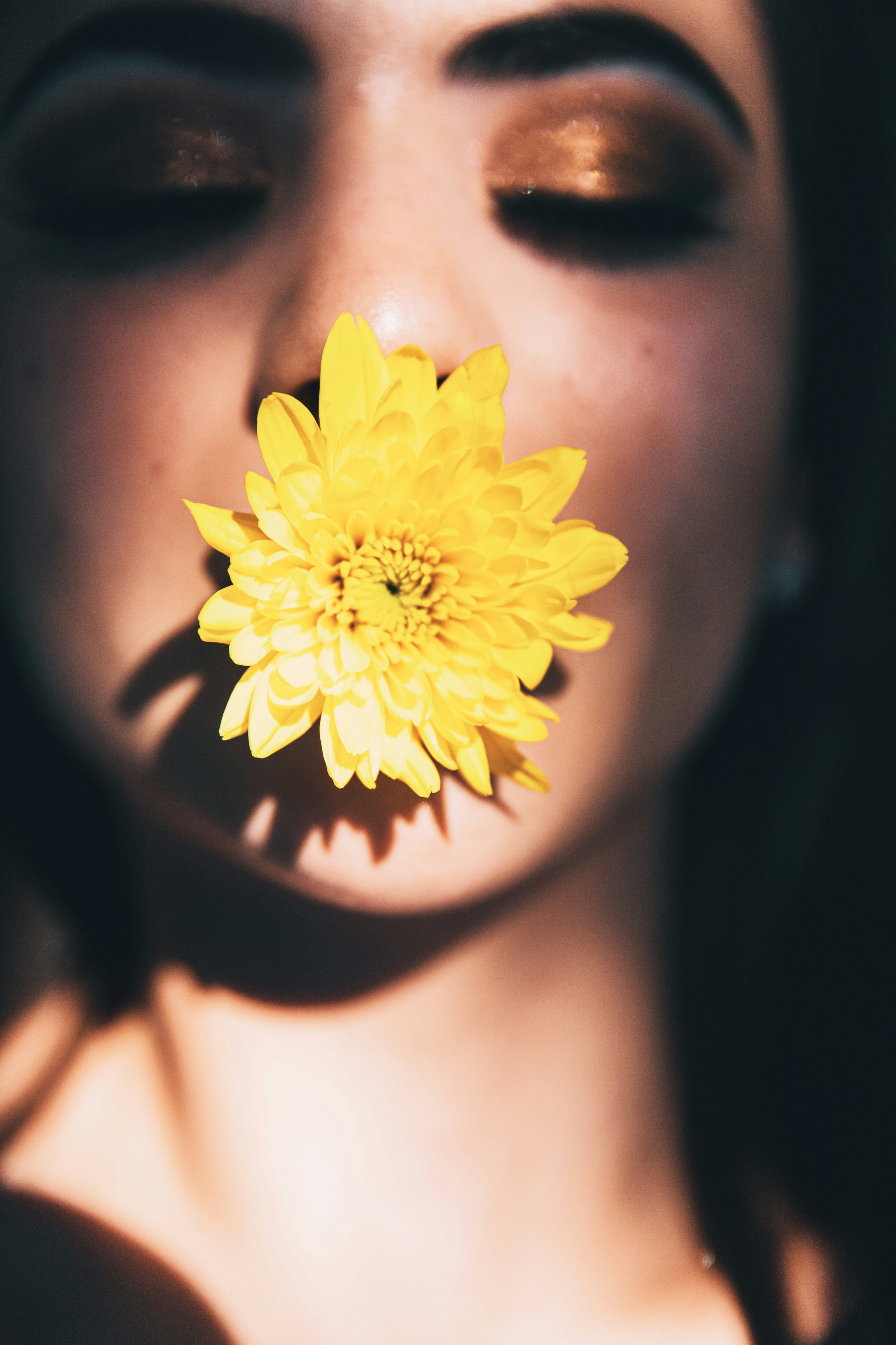 yellow flower on womans breast